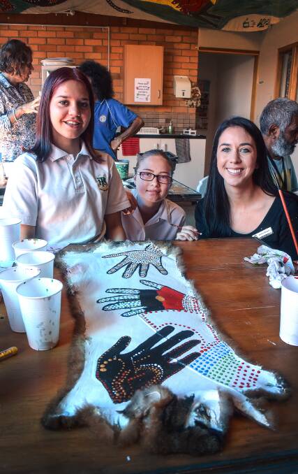 FROM THE ART: Year 10 Peel High students Sharika Nean Bell and Lateshia Faulkner with Aboriginal studies teacher Donna Burges. Photo: Jacob McArthur 270317JMA02