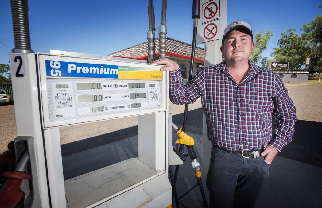 NO RISE: Ben Clifton won't be letting his fuel price travel north ahead of the long weekend. Photo: Peter Hardin 211216PHA009