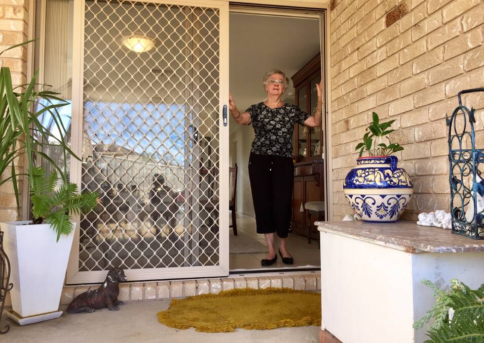 GET OUT: Sandra Schneider witnessed a snake slither in to her home a week ago, she hasn't been game to sleep at home since. Photo: Jacob McArthur