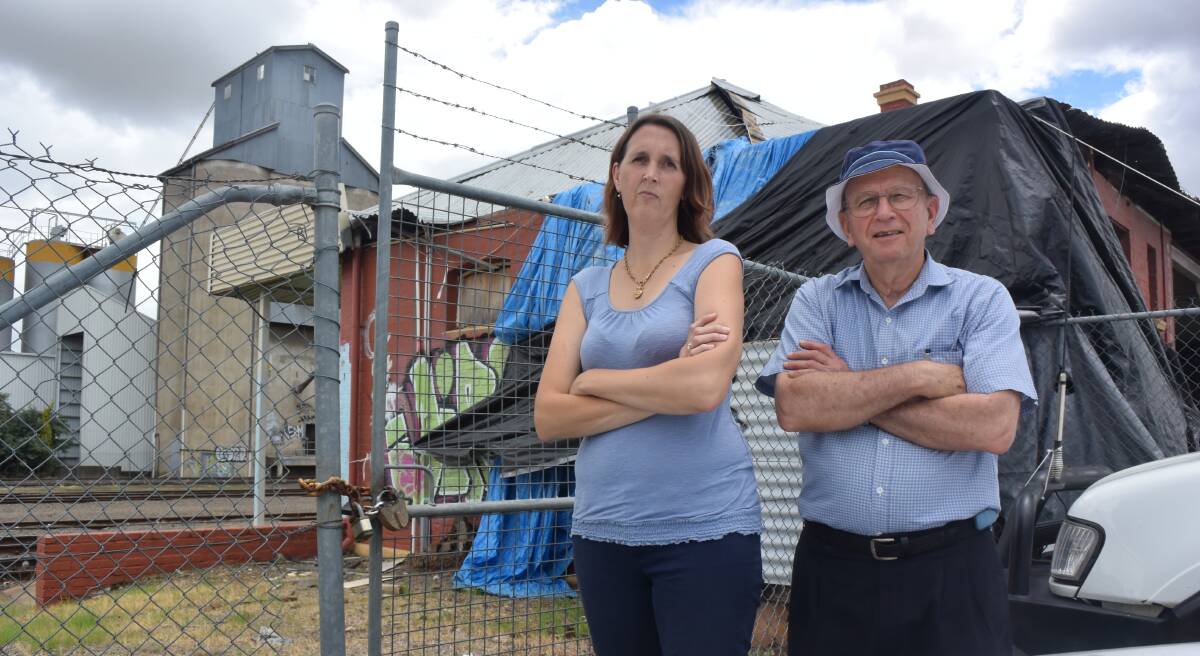 GOING SOON: Historical society members Melinda Gill and Rod Hobbs don't want the West Tamworth station torn down. Photo: Jacob McArthur
