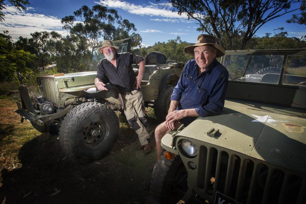 START YOUR ENGINES: Carl Flannery (left) and Graham Meyer have been driving veterans in their Jeeps in Tamworth for many decades. Photo: Peter Hardin 240417PHA013