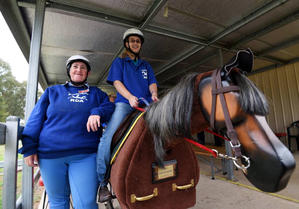 CONFIDENT: Clients and volunteers Kelly Usher and Sarah Hoskins have greatly benefited from the service of RDA. Photo: Gareth Gardner 290617GGB02