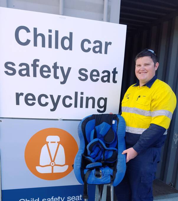 WASTE NOT: Forest Road Waste Management Centre Operator Kurt Mansfield with a child restraint to be recycled as part of a national waste trial. Photo: Supplied