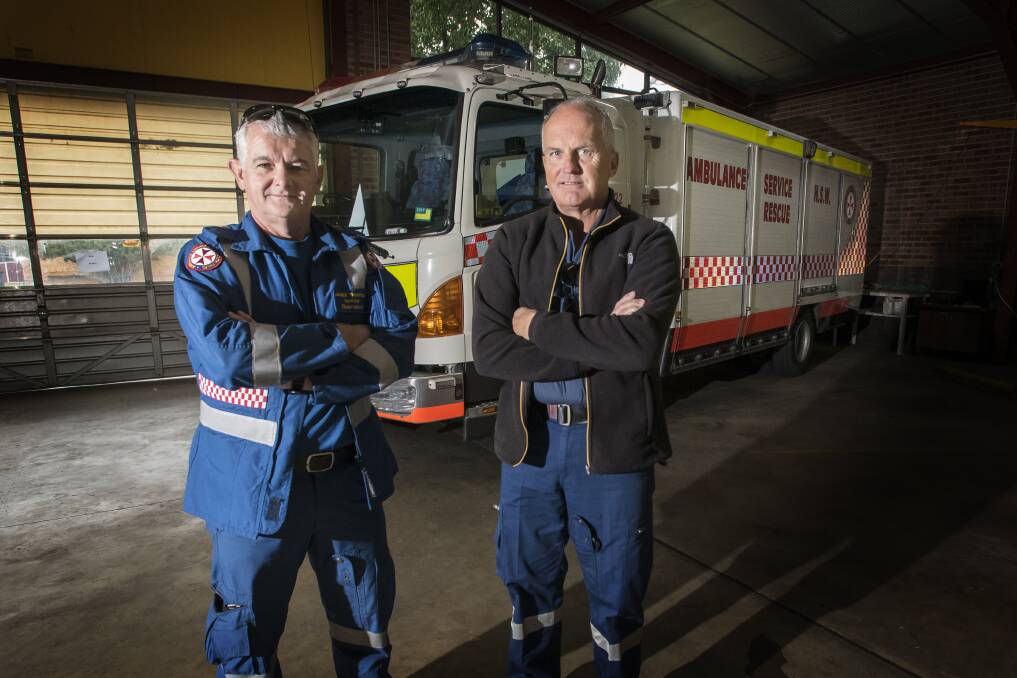 IN NEED: Tamworth paramedics James Thompson and Brian Bridges with the rescue truck. Photo: Peter Hardin 210817PHB011