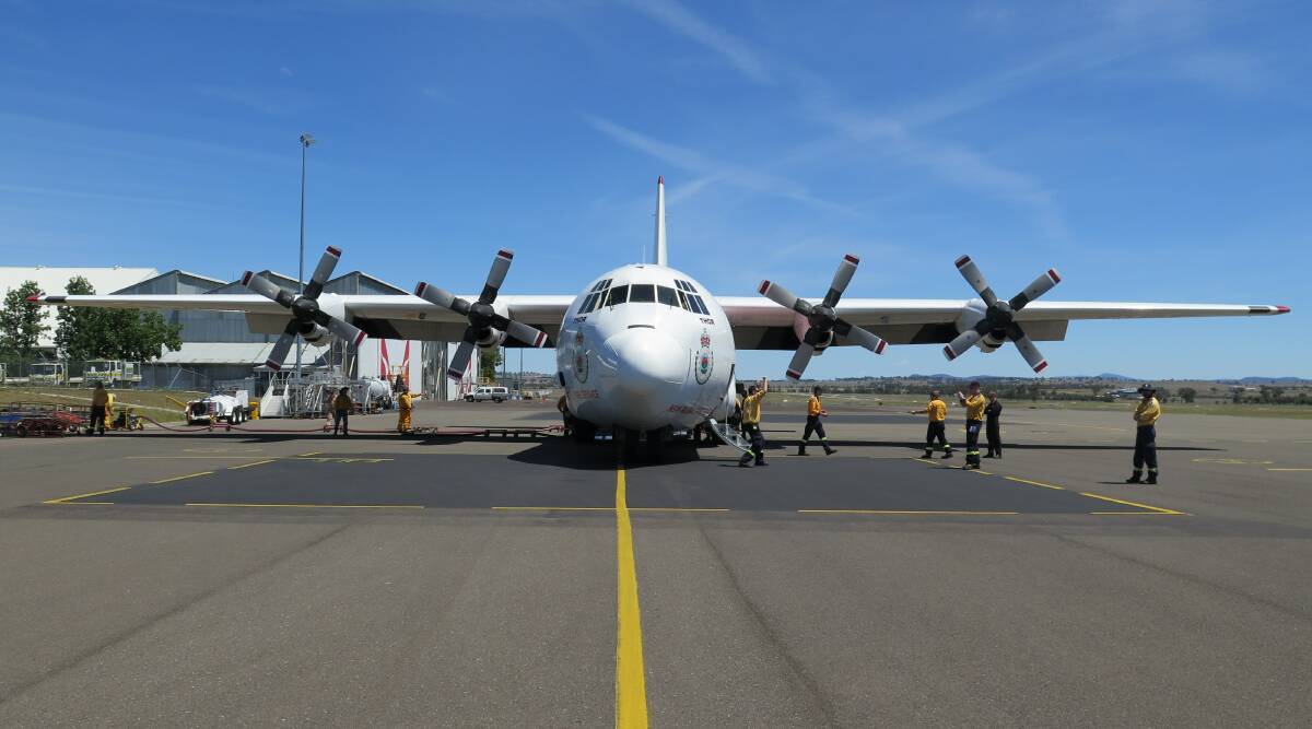 HAMMERING HOME: More than 50 RFS volunteers and staff trained with the Hercules C130 tanker Thor in Tamworth this weekend. Photo: Supplied 