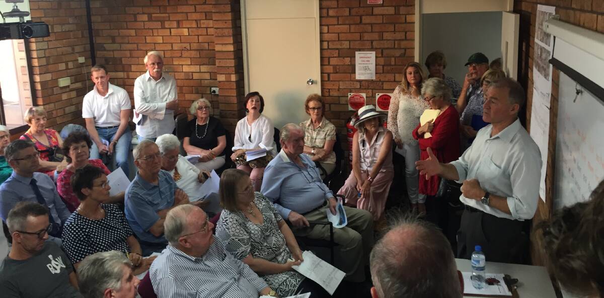 PEOPLE POWER: Council director Peter Resch grilled by nearly 50 White St residents  in opposition to impending works. Photo: Jacob McArthur
