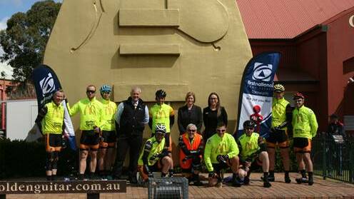 ON THE MOVE: Charity riders with sponsors from First National Tamworth David Doherty and Margo Taggart. Photo: Supplied 