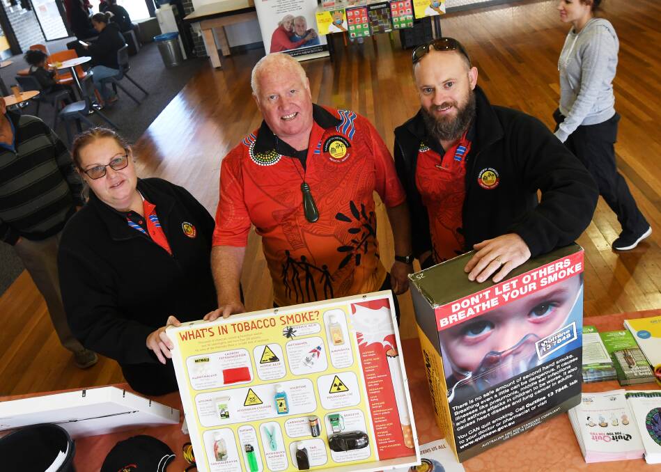 SMOKE SIGNALS: Tamworth Aboriginal Medical Service workers Liat Foley, Pete France and Damion Brown pushing a campaign against smoking. Photo: Gareth Gardner