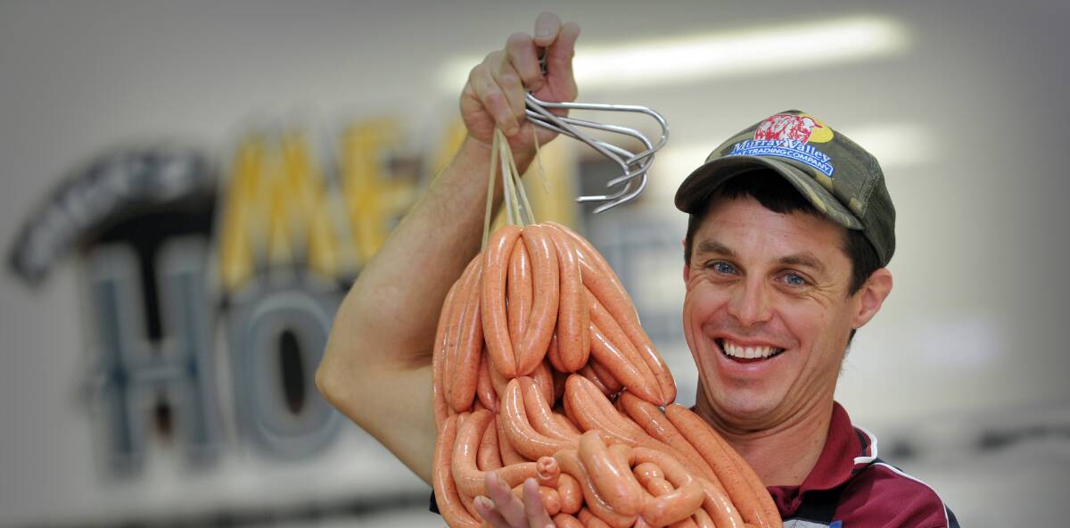 BEST BANGERS: Tamworth butcher Mick Newton admirably claimed third place in the Sausage King state finals pork category. Photo: Paul Mathews 180116PMA09