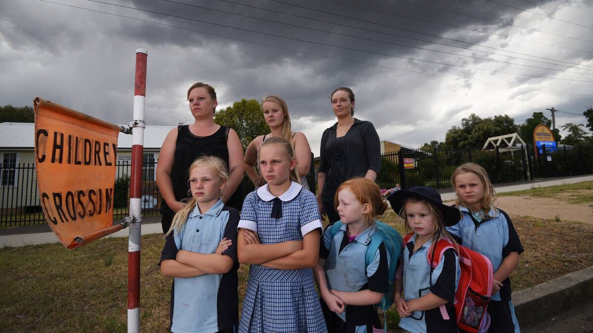 CHANGE: Back from left: concerned parents Sallie Vernon, Tarsh Melder and Nicola Stockdale are calling for more road safety measures. Front from left: Addyson and Bella Vernon, Chanel Stockdale, Kahliah Day and Pheobe Vernon. Photo: Gareth Gardner