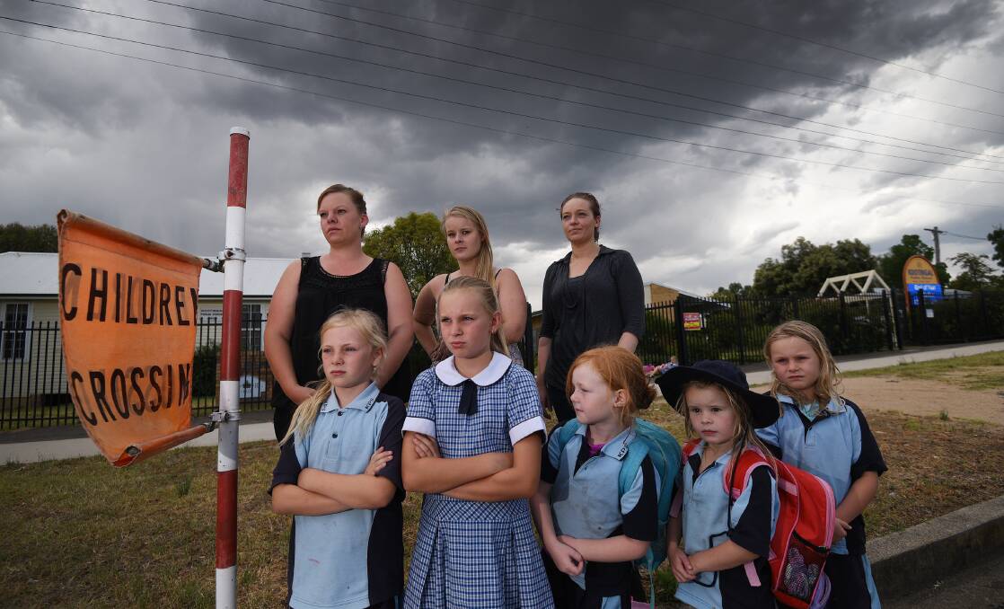 CHANGE: Back from left: concerned parents Sallie Vernon, Tarsh Melder and Nicola Stockdale are calling for more road safety measures. Front from left: Addyson and Bella Vernon, Chanel Stockdale, Kahliah Day and Pheobe Vernon. Photo: Gareth Gardner 301116GGD02