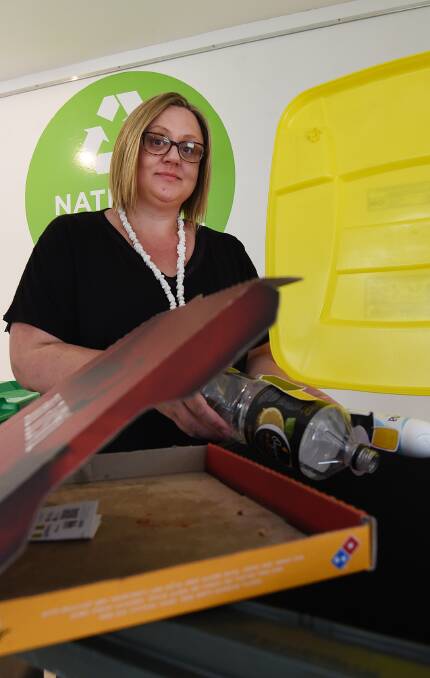 RIGHT RUBBISH: Tamworth Regional Council sustainability coordinator Tracey Carr with a lesson for National Recycling Week Photo: Gareth Gardner 071116GGA01