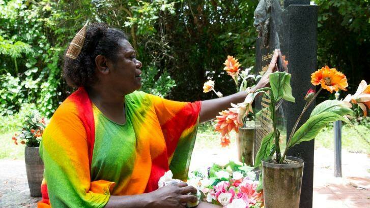 Eddie Mabo's daughter, Celuia Mabo, who lives in Brisbane, becomes emotional at the grave of her father, on Mer Island in the Torres Strait.  Photo: Janie Barrett