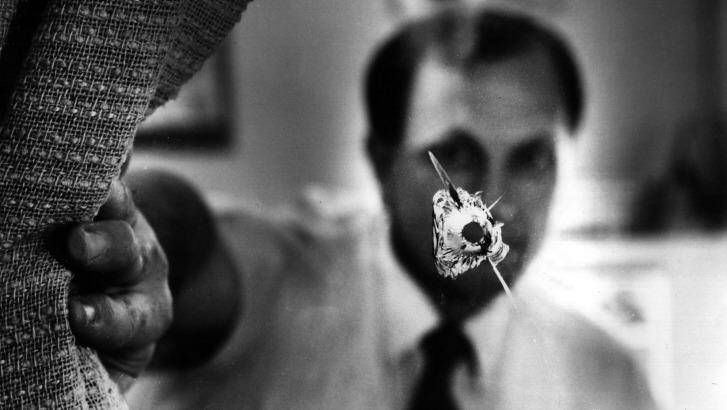 Murdered: John Newman and a bullet hole in his Canley Heights office in 1993. Photo: Supplied