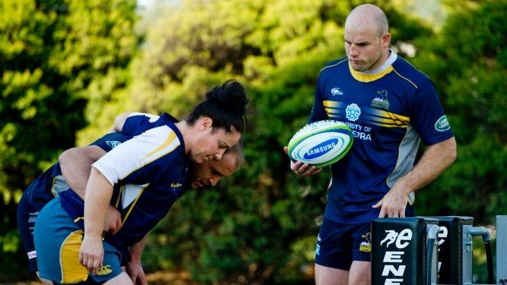 Wallaroos front rower Louise Burrows getting some pointers from Brumbies players Stephen Moore and Ben Alexander in 2014. Photo: Jay Cronan