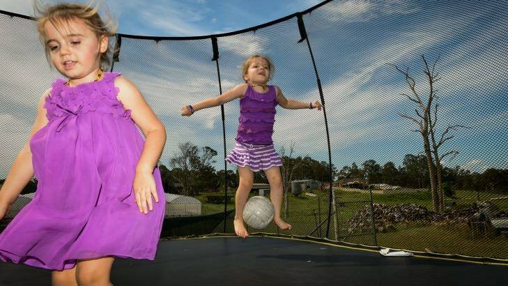 Parents hold out for medical cannabis trial: Bethany Edwards plays at home with younger sister Lara. Photo: Brendan Esposito