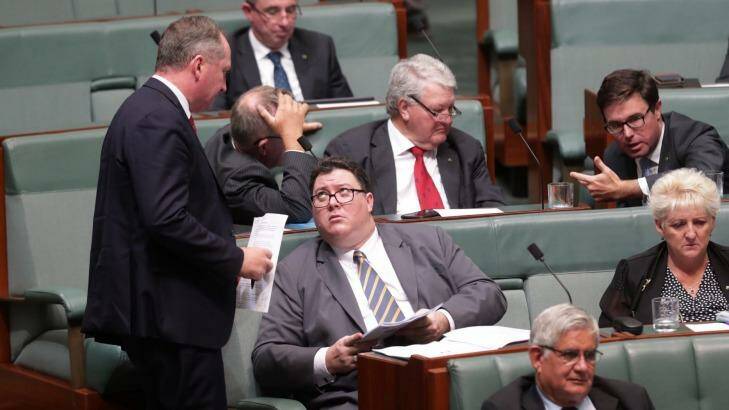 Deputy Prime Minister Barnaby Joyce speaks with George Christensen during question time at Parliament House in Canberra on Tuesday. Photo: Andrew Meares