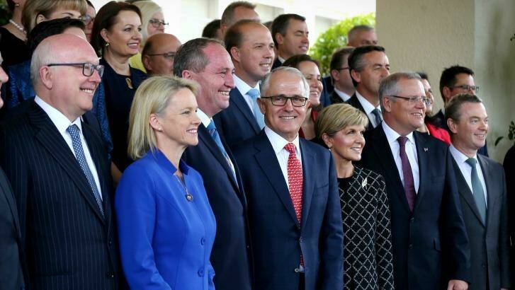 Prime Minister Malcolm Turnbull poses for photos with his ministry after the swearing-in ceremony on Tuesday. Photo: Alex Ellinghausen