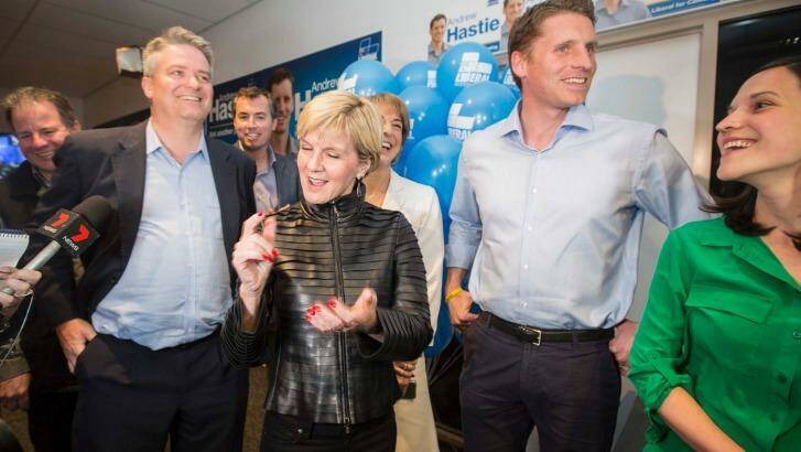 Mathias Cormann, Julie Bishop and Andrew Hastie celebrating Liberal victory in Canning. Photo: Tony McDonough