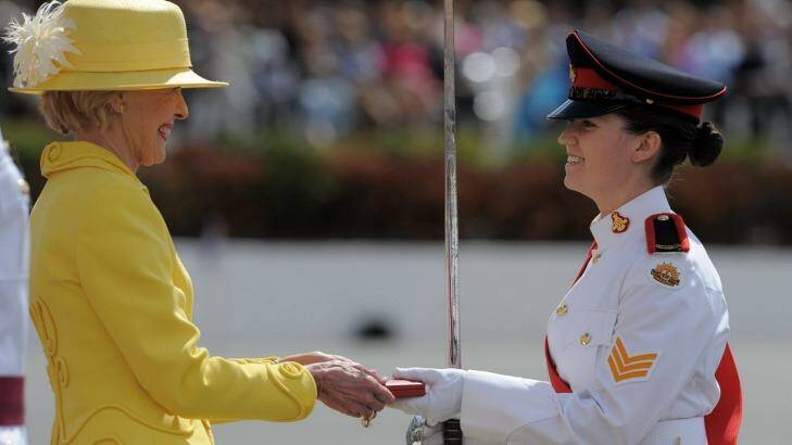 Top of the class: Then governor-general Quentin Bryce hands the 2012 Queen's medal to Briony Morgan at Royal Military College, Duntroon. Photo: Graham Tidy