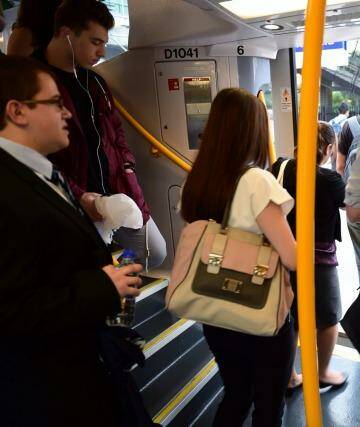 Commuters change trains at Glenfield on the new South West Rail Link on Friday.  Photo: Nick Moir