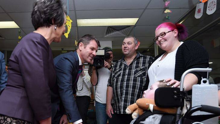 Pru Goward, left, and Mike Baird  talk with Matthew Oldenburg and Nicole Suttle, whose son, Tyler, 7, suffers from severe epilepsy.  Photo: Kate Geraghty
