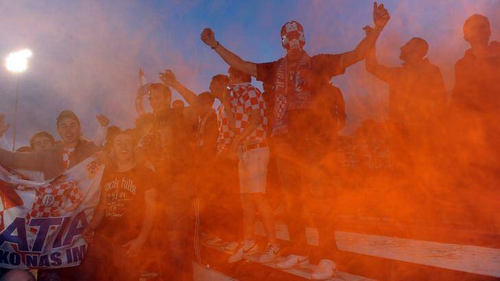 Canberra FC fans let off flares during the 2011 Canberra Premier League grand final. Photo: Gary Schafer