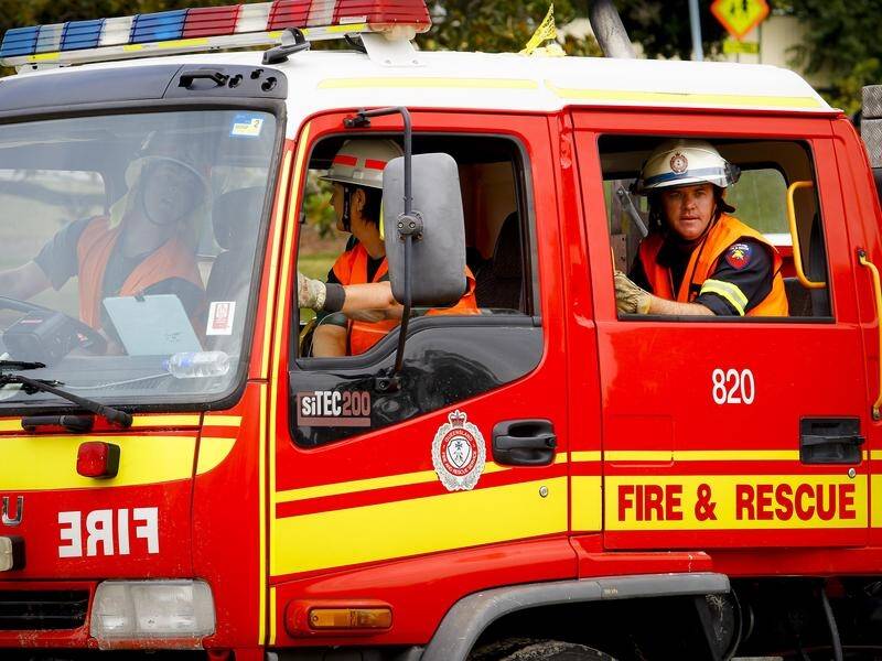 Fire crews have quelled a blaze which destroyed half a factory in Brisbane's south. (Patrick Hamilton/AAP PHOTOS)