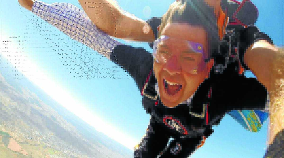 MP FLYING: Kevin Anderson looks like he's having fun - but it's not a leap he's set to do again after a skydive last weekend.