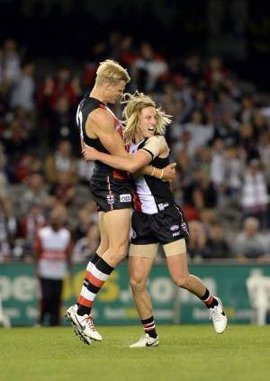 Nick Riewoldt shares Eli Templeton’s joy at his first goal. Photo: Mal Fairclough