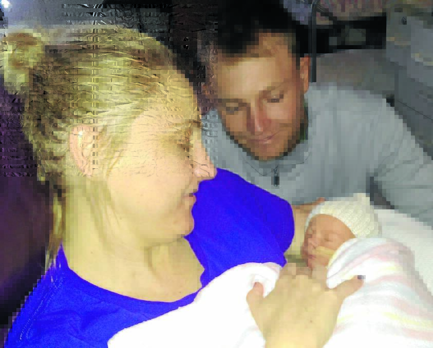 MIRACLE BUB: Tamworth accountant Kylie King and partner Brock Sampson with new baby Addie Eve Sampson, who arrived by caesarian section two weeks ago. Ms King, who had a double organ transplant three years ago, feared she may never be able to give birth.