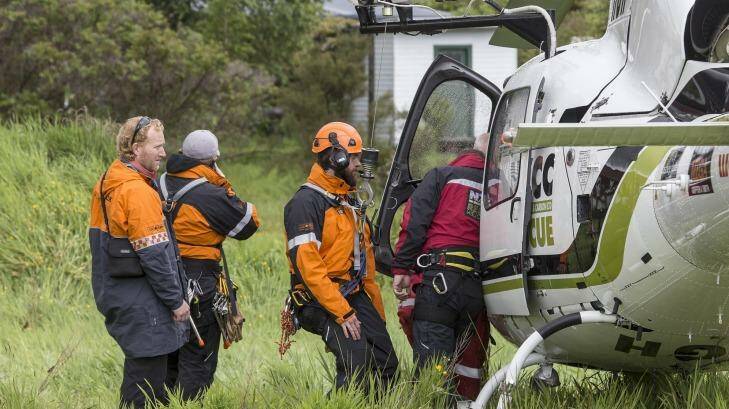 Rescue crew board a helicopter to head to the Fox Glacier valley where a helicopter crashed. Photo: Iain McGregor