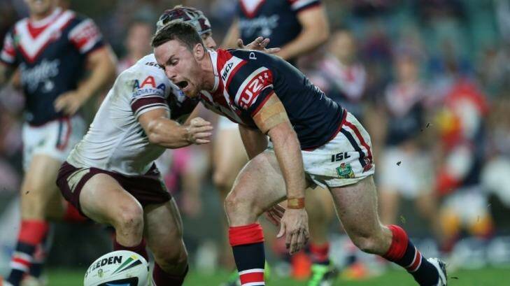 Setback: Roosters five-eighth James Maloney  yells as the ball slips from his hands against Manly. Photo: Anthony Johnson