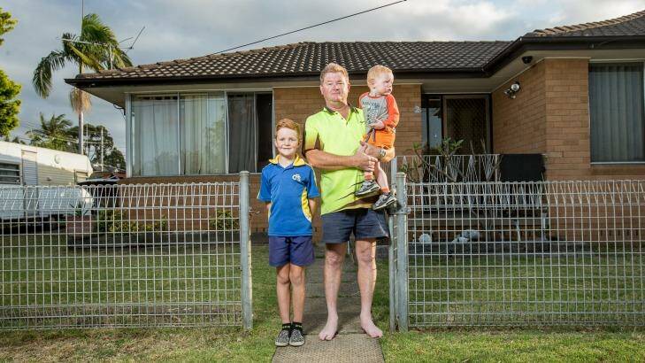 David Inverarity and sons Nathan, 8, and baby Luke. Mr Inverarity doesn't want a pub built close to his son's Casula school. Photo: Cole Bennetts