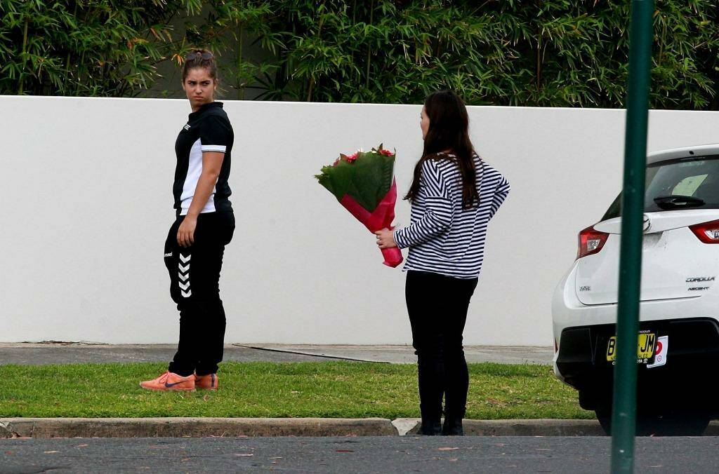  Friends of Georgina Bartter arrive at her home with flowers. Photo:  Ben Rushton