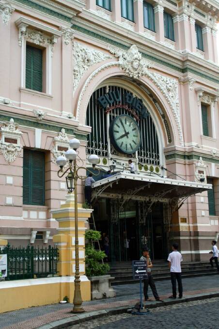 The clock above the entrance of the Ho Chi Minh City post office. Photo: Brian Johnston
