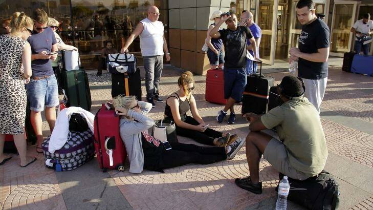 Russian passengers wait outside the Sharm el-Sheikh Airport. Photo: Ahmed Abd El-Latif/AP