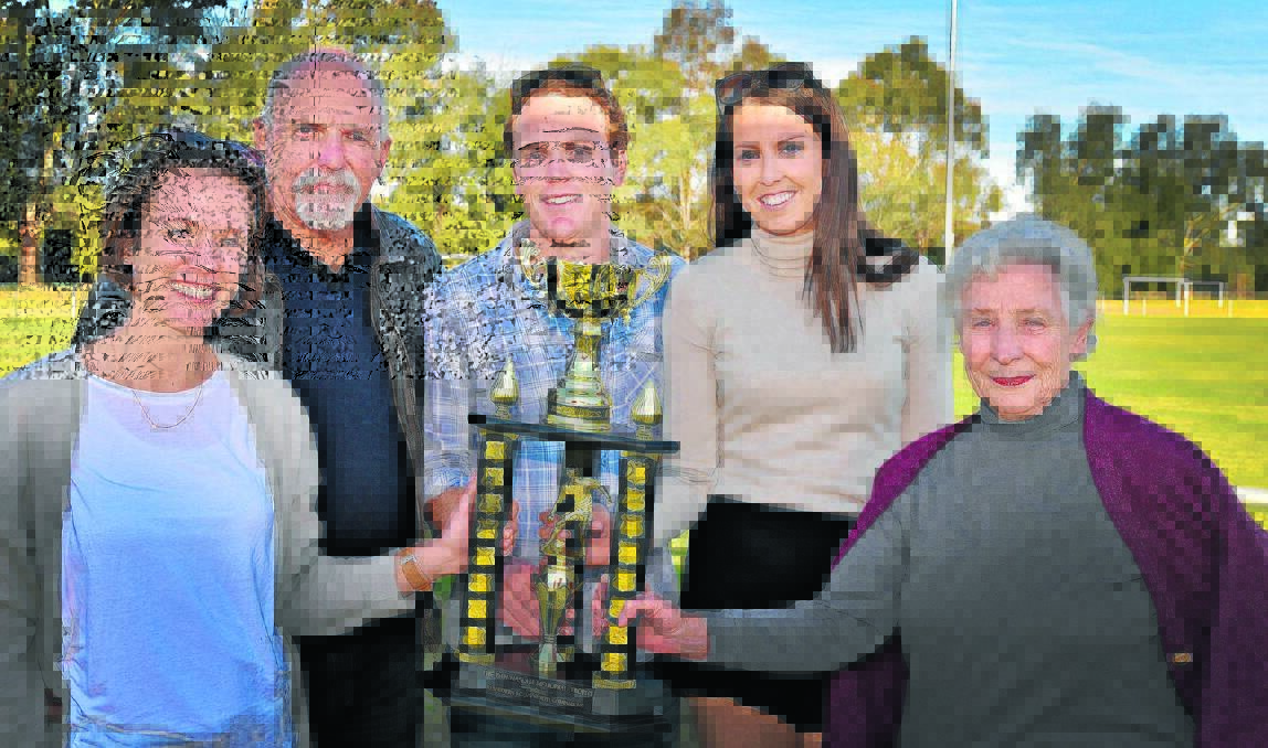 LASTING LEGACY: From left, Dan Haslam’s wife, Alyce, father Lou Haslam, brother Billy Haslam, sister-in-law-to-be Charlotte Jolli and grandmother Pat Wake prepare to present the new Dan Haslam Memorial Trophy. Photo: Geoff O’Neill 010815GOE03
