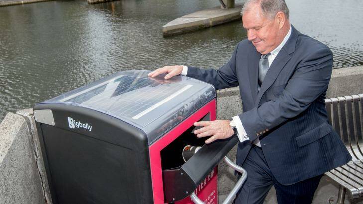 Melbourne's Lord Mayor Robert Doyle with one of six BigBelly bins recently installed there. Photo: Penny Stephens