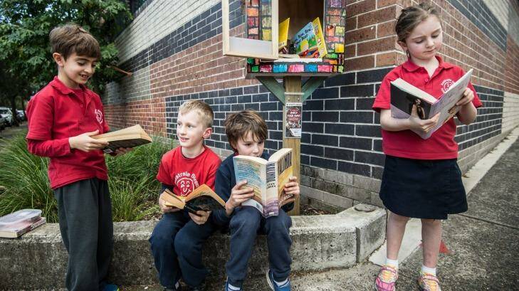 Students from Australia Street Infant School taking books from their Street Library. Photo: Wolter Peeters