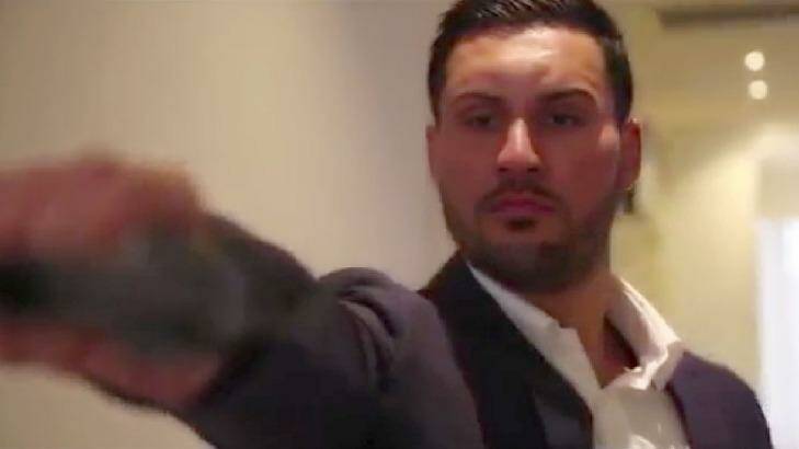 In one scene, Salim Mehajer is shown holding and firing a gun.  Photo: Screenshot: YouTube