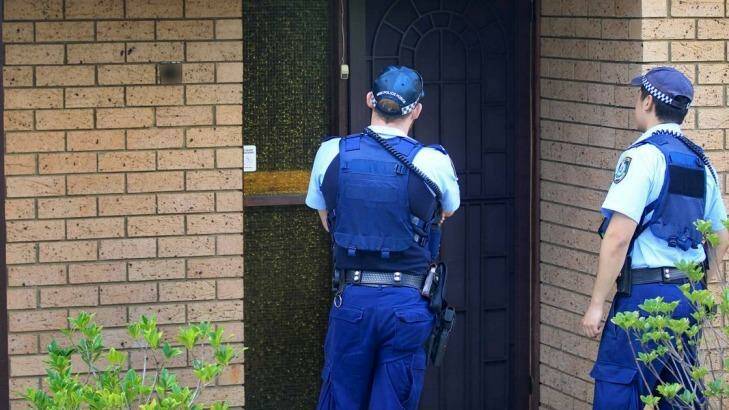Police officers at the home of the 16-year-old boy.  Photo: James Alcock