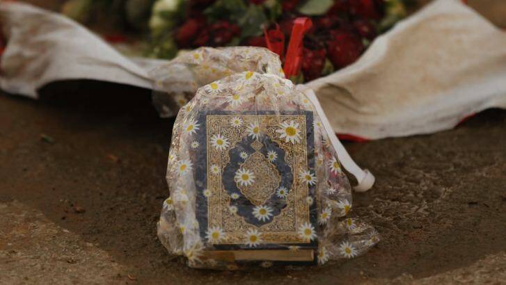 Memorial: Ahmad Saleh's koran lays on top of his grave in the Hezbollah Martyr cemetery in Brital village, Lebanon.  Photo: Kate Geraghty