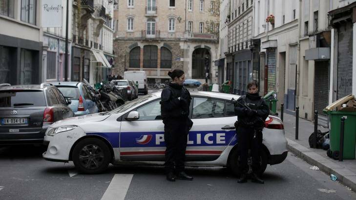 Police guard the crime scene near the La Belle Equipe cafe in Paris, France on Saturday. Photo: Andrew Meares