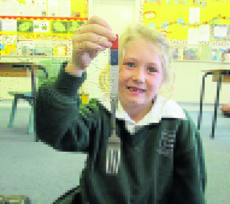 Riley Collins discovers magnetic magic with kitchen cutlery.