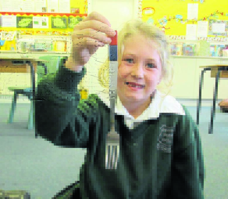 Riley Collins discovers magnetic magic with kitchen cutlery.