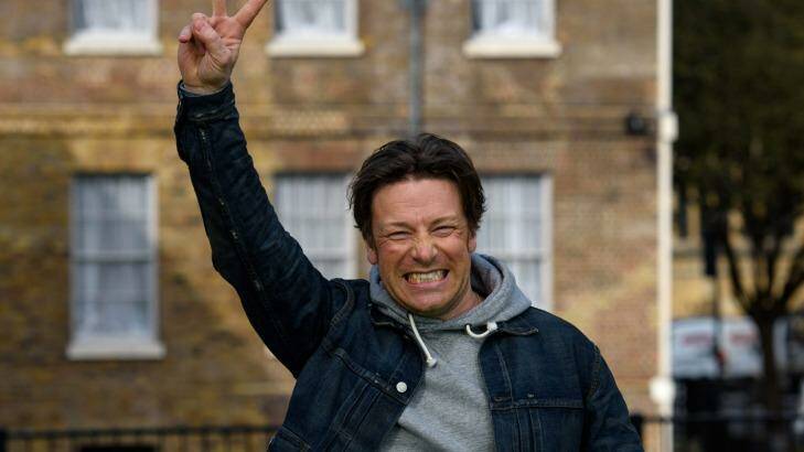 Jamie Oliver celebrates after the announcement of a tax on sugary soft drinks in the UK. Will Australia follow? Photo: Getty Images/Ben Pruchnie