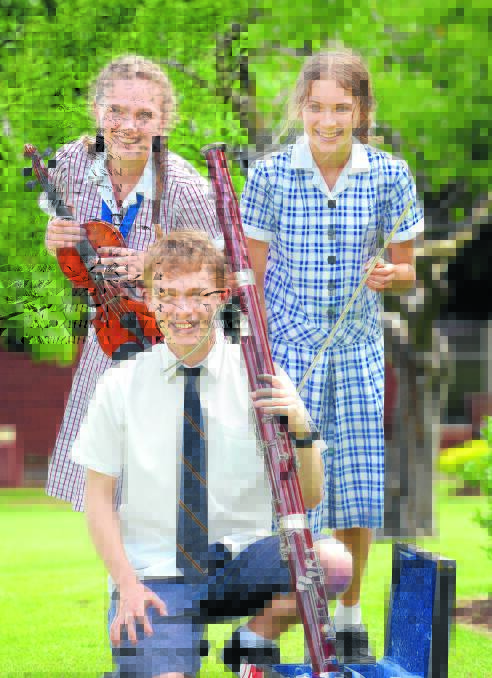 IN TUNE: Tamworth students, Michaela Beavan (Calrossy), Toby Harradine (Oxley High) and Ella Low (Calrossy) have been chosen for an exclusive three day workshop in Bellingen with the Sydney Symphony Orchestra. Photo: Barry Smith 031115BSD03
