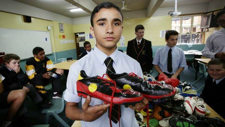 Helping out: Logan Aldridge,13, is donating his boots. Photo: Jessica Hromas