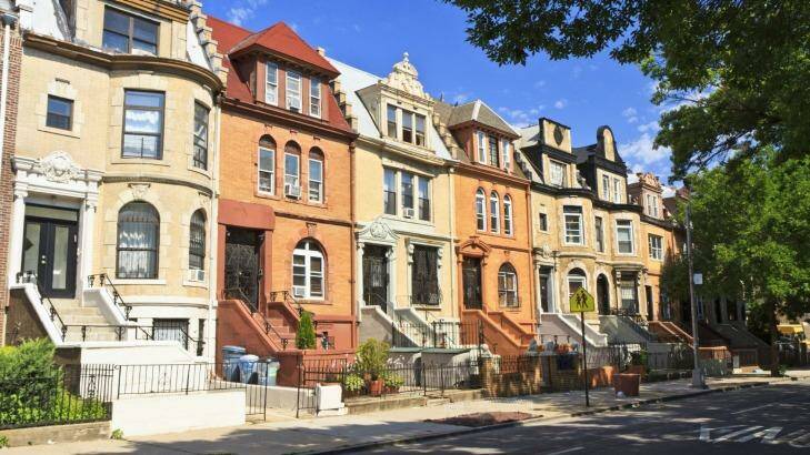 A row of unique townhouse apartment buildings with stoops on New York Ave. Photo: iStock